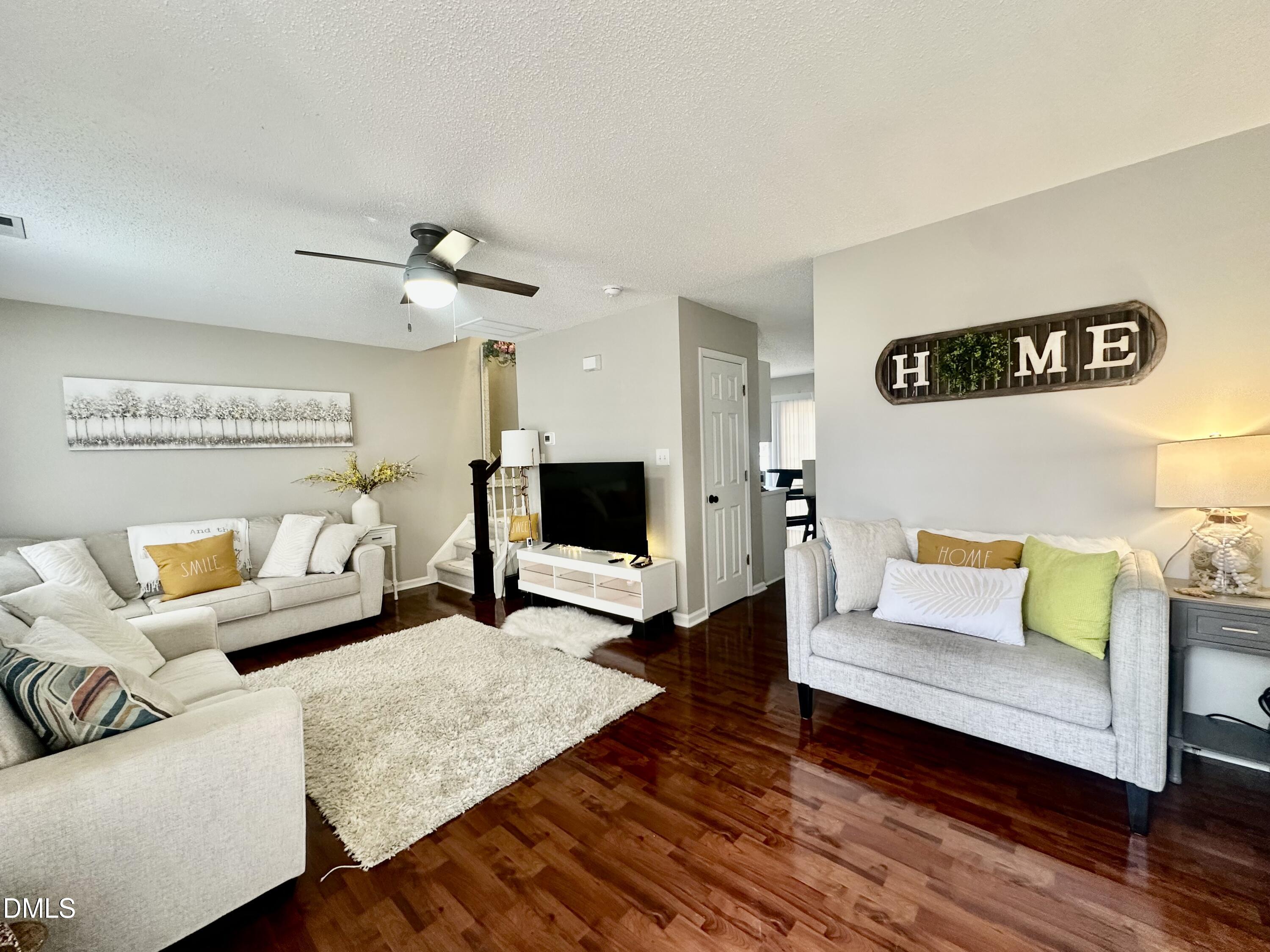2106 Walnut Bluffs Lane Raleigh, NC 27610 - Photo 2 of 15 a living room with furniture and wooden floor