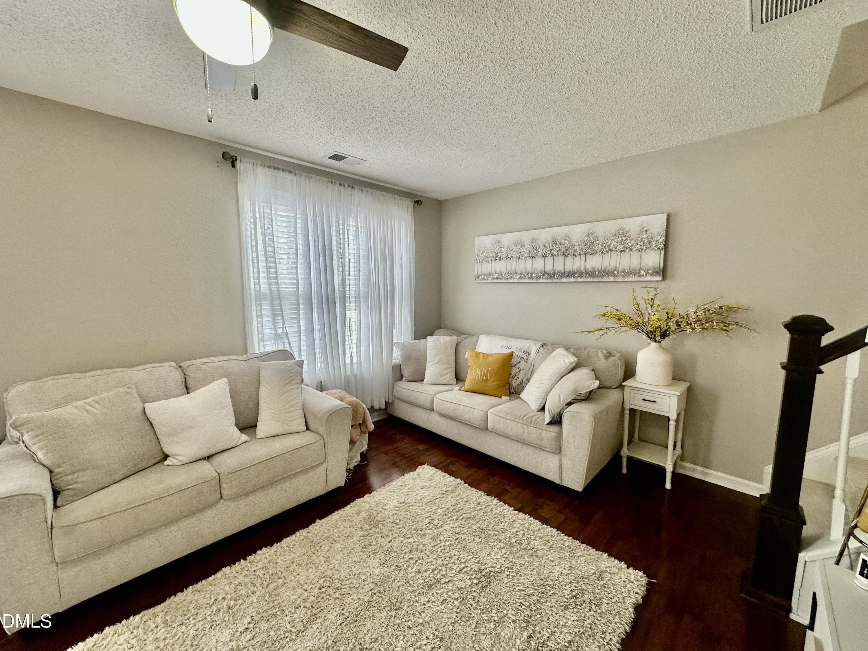 2106 Walnut Bluffs Lane Raleigh, NC 27610 - Photo 6 of 15 a living room with furniture and wooden floor