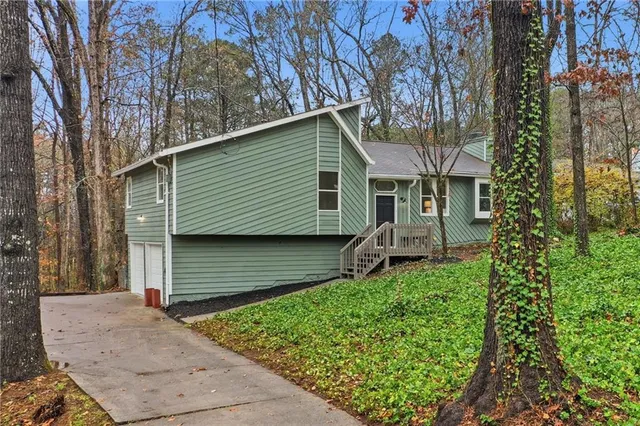 a backyard of a house with lots of green space