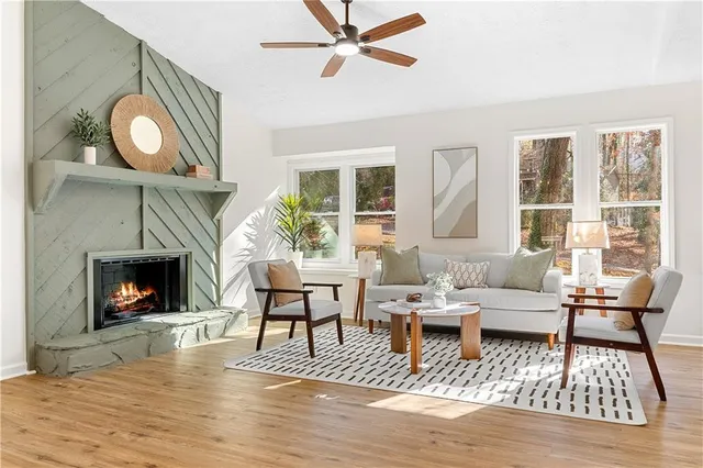 a living room with furniture and a fireplace