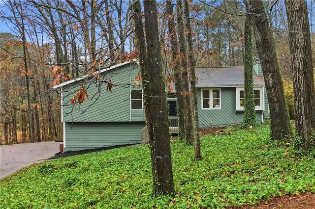 a view of a wooden house with a small window
