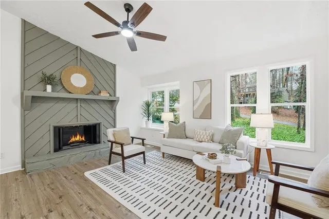 a living room with furniture and a fireplace