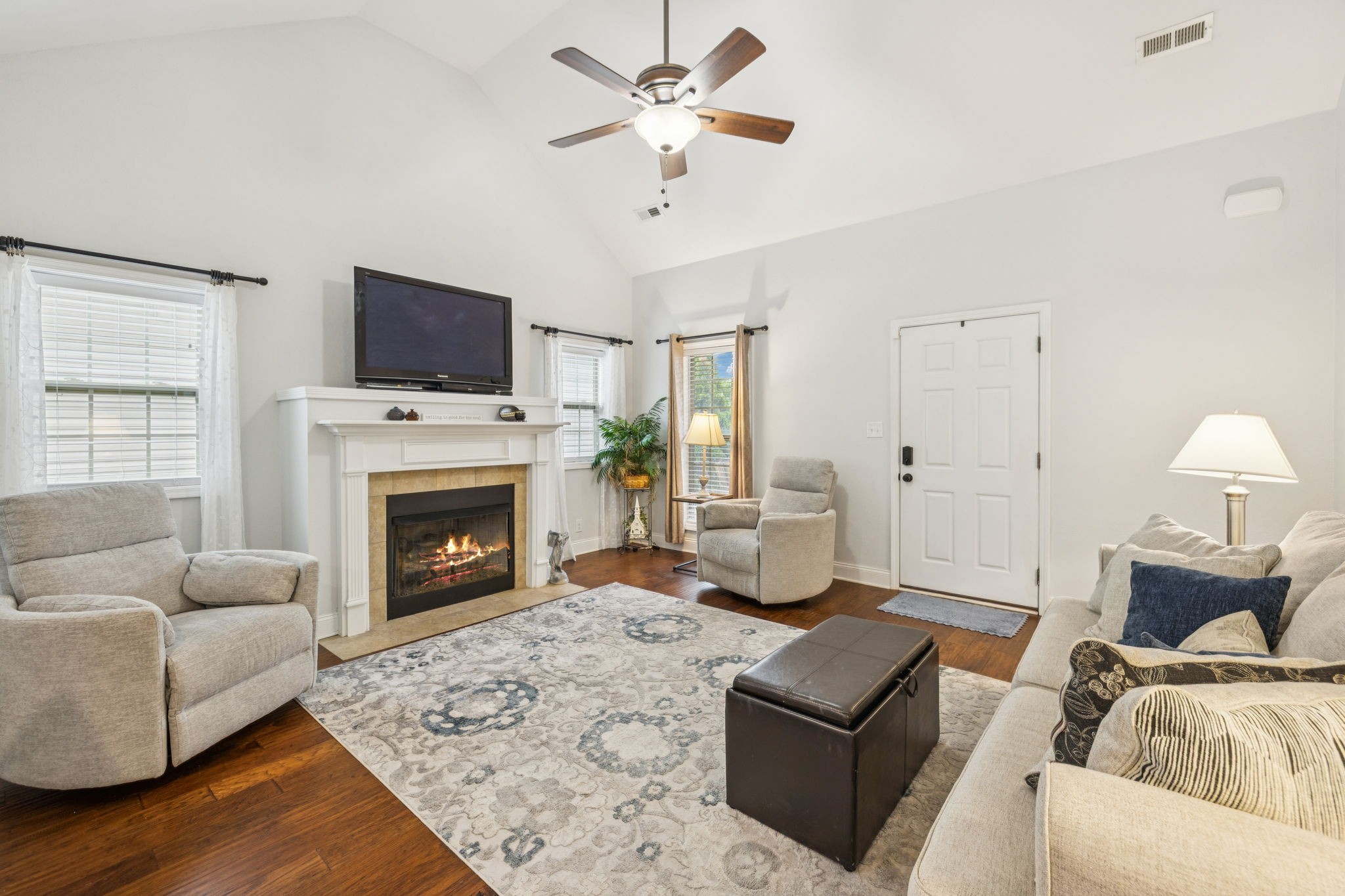 188 Whitman Alley Clarksville, TN 37043 - Photo 5 of 28 a living room with furniture a flat screen tv and a fireplace