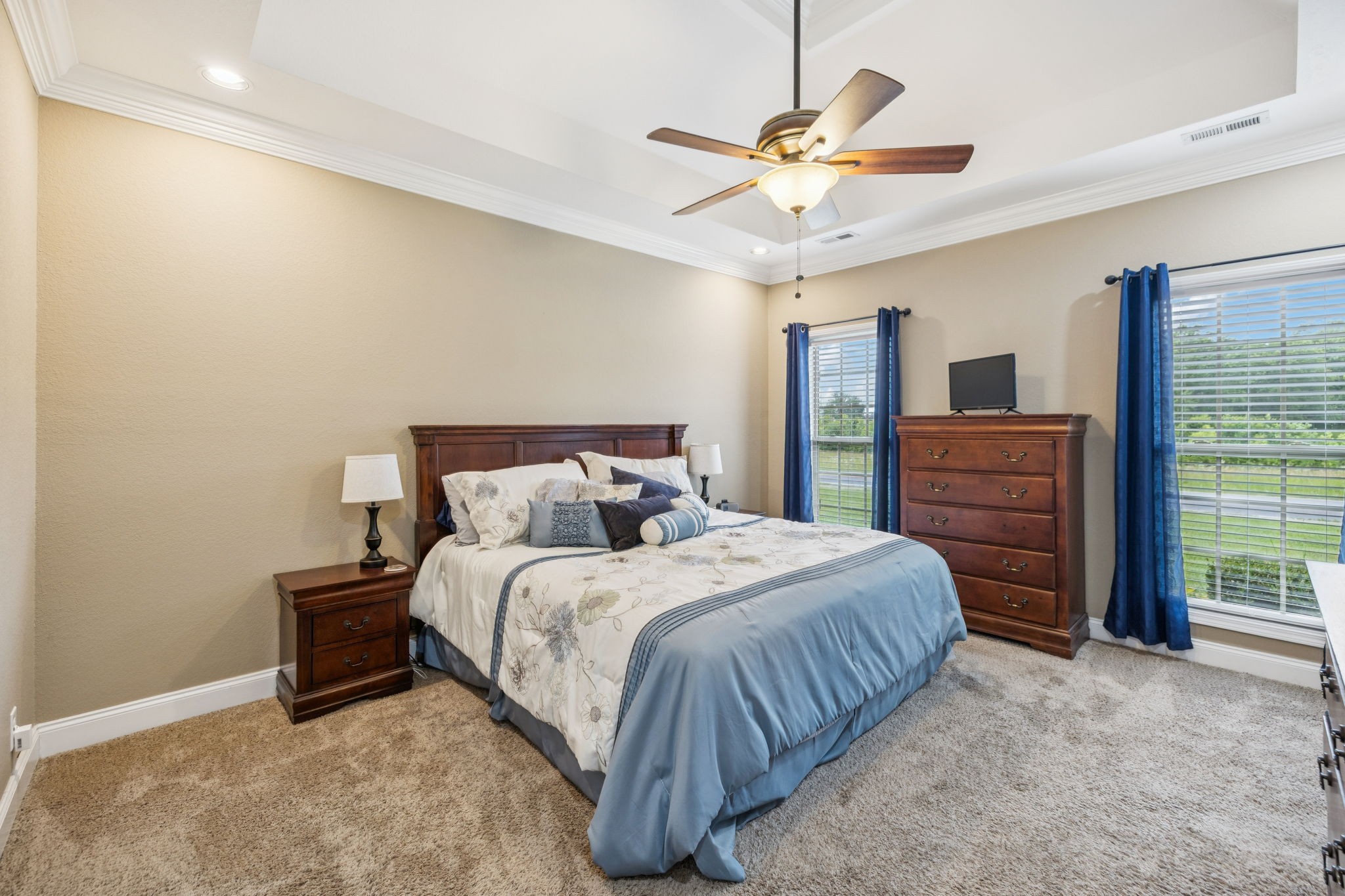 188 Whitman Alley Clarksville, TN 37043 - Photo 9 of 28 a bedroom with a bed a dresser and a chandelier