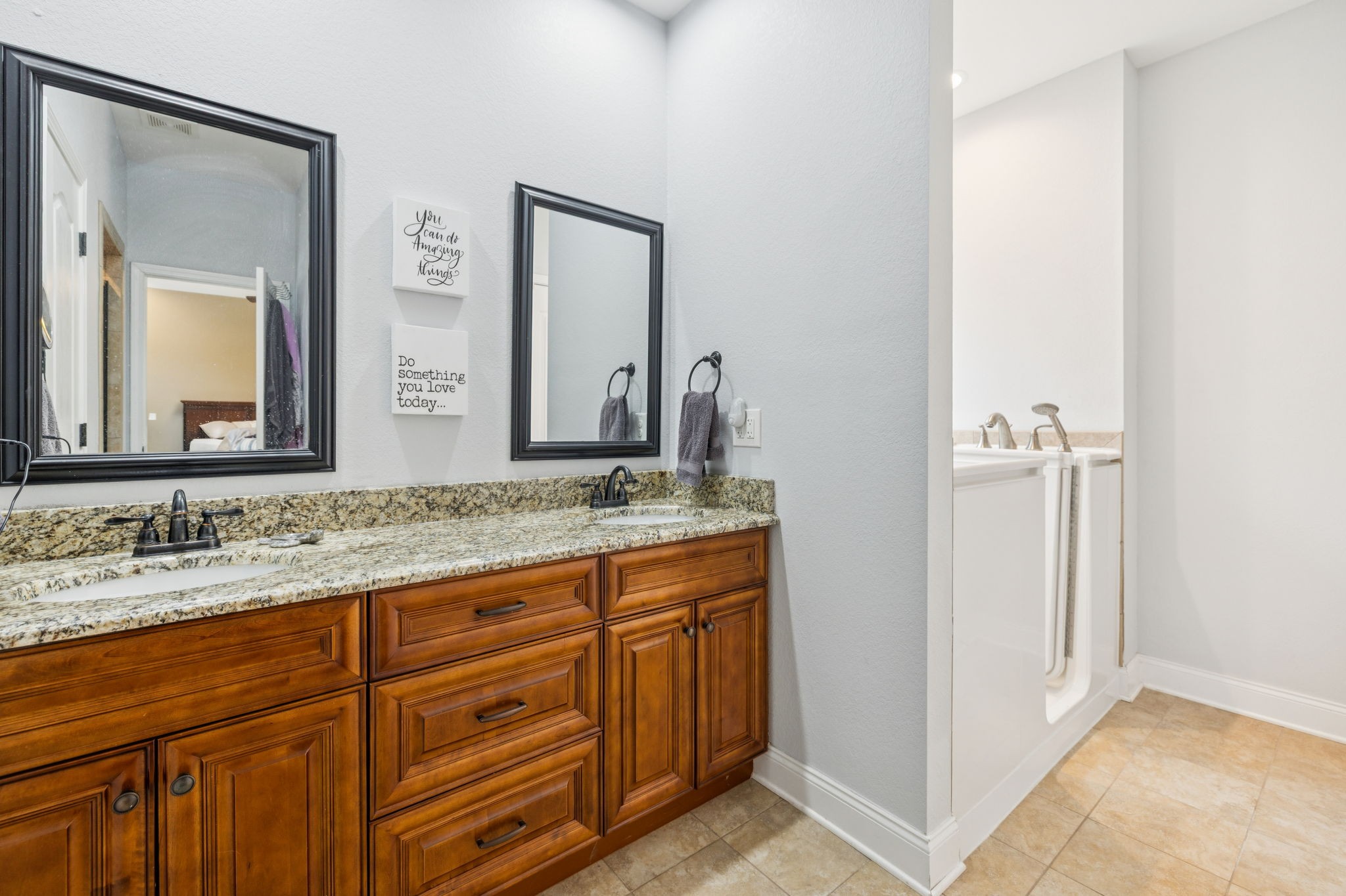 188 Whitman Alley Clarksville, TN 37043 - Photo 10 of 28 a bathroom with a granite countertop sink and a mirror