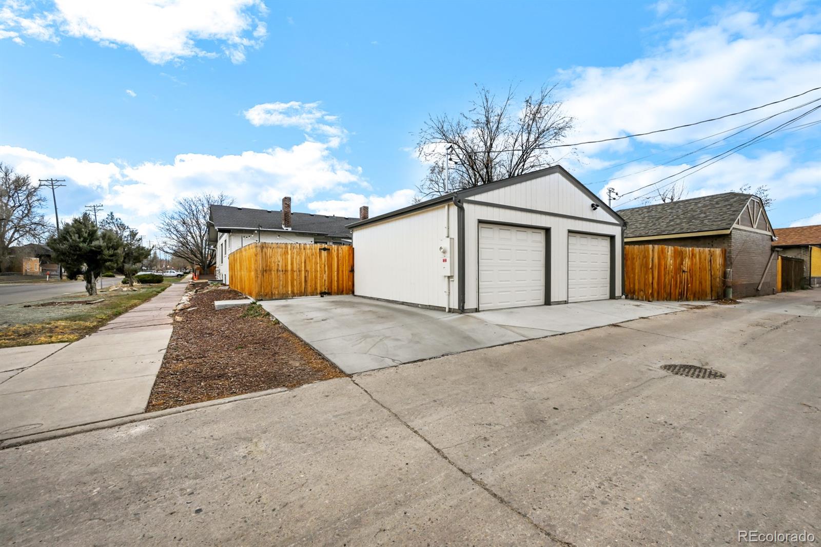 1402 Meade Street Denver, CO 80204 - Photo 22 of 23 a view of a house with a yard