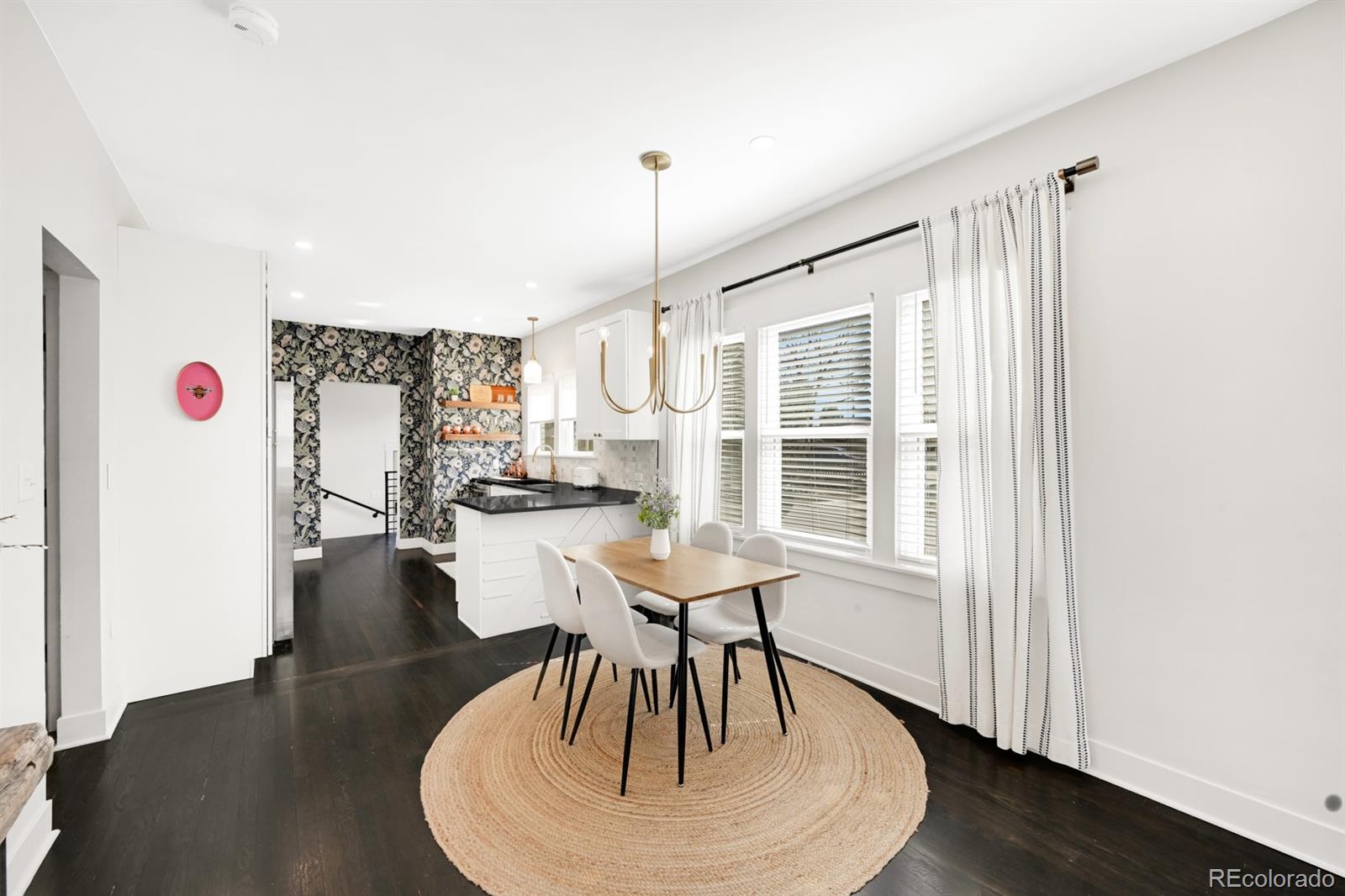 1402 Meade Street Denver, CO 80204 - Photo 8 of 23 a living room with furniture and a wooden floor