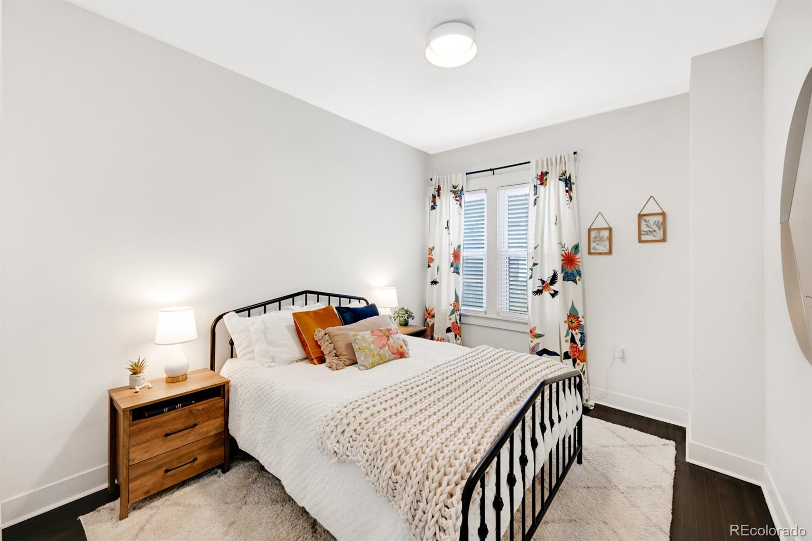 1402 Meade Street Denver, CO 80204 - Photo 10 of 23 a bedroom with a bed and a window