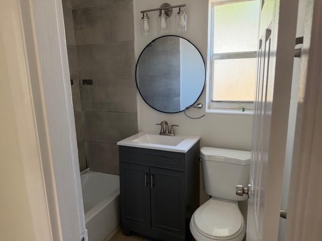 141 Southeast 7th Avenue Boynton Beach, FL 33435 - Photo 6 of 7 a bathroom with a toilet sink and mirror