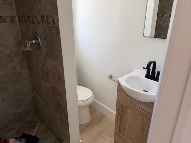 141 Southeast 7th Avenue Boynton Beach, FL 33435 - Photo 7 of 7 a bathroom with a sink a toilet and shower