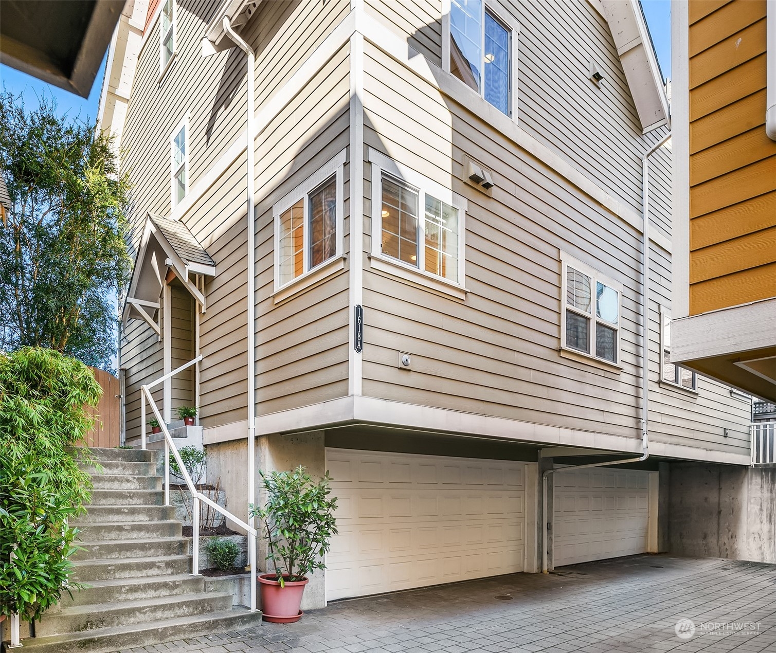 1618 North 46th Street, Unit A Seattle, WA 98103 - Photo 3 of 26 a front view of a house with balcony