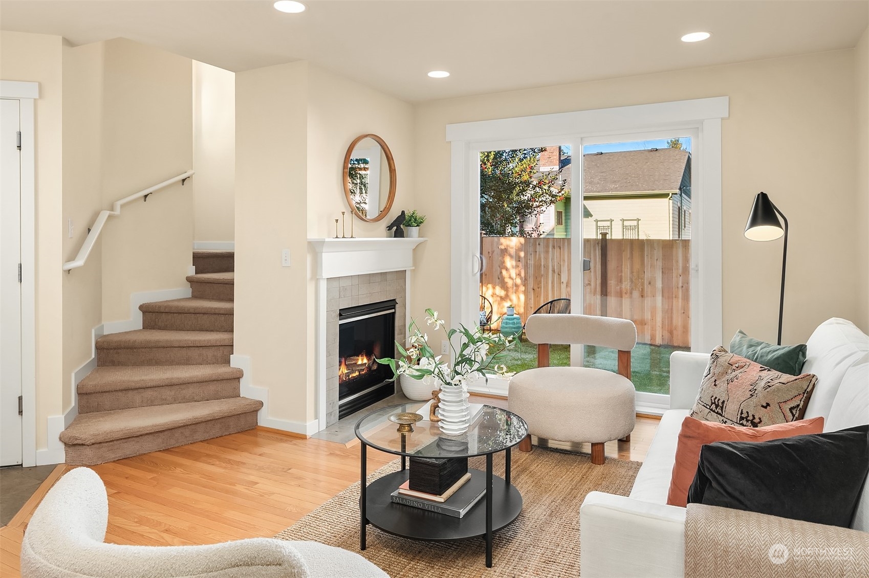 1618 North 46th Street, Unit A Seattle, WA 98103 - Photo 7 of 26 a living room with furniture and a fireplace