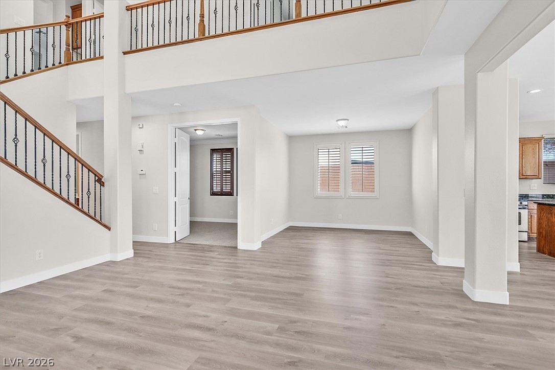 2447 Kaymin Ridge Road Henderson, NV 89052 - Photo 10 of 40 Gleaming wood-look floors complement the soaring ceilings and open layout of this grand interior entryway.
