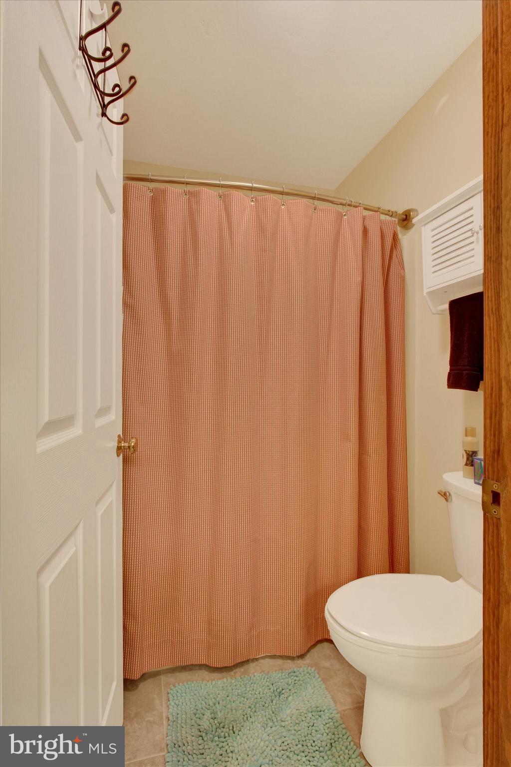 1844 Liberty Road Spring Grove, PA 17362 - Photo 34 of 52 a white toilet sitting next to a shower curtain