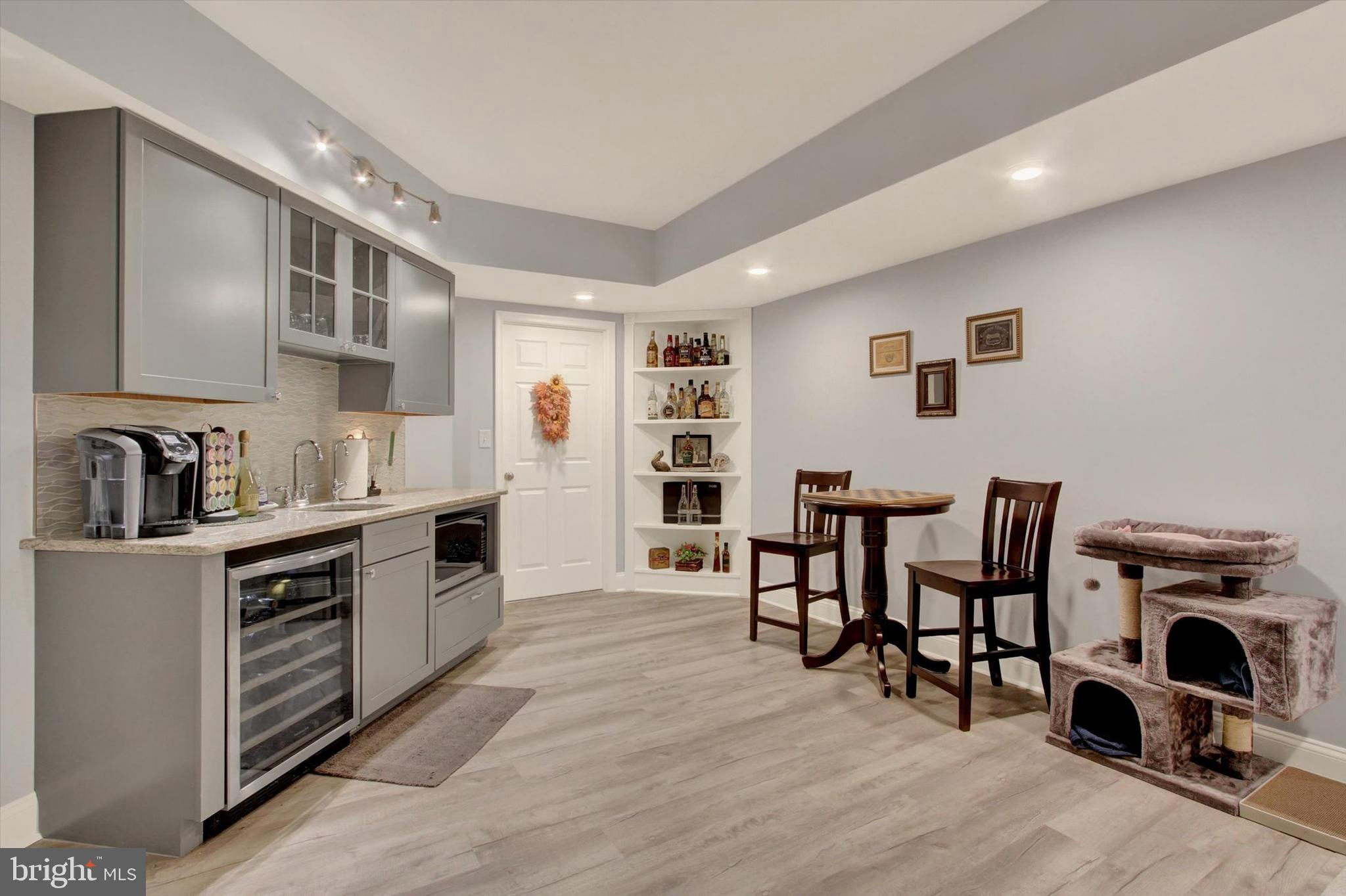 1844 Liberty Road Spring Grove, PA 17362 - Photo 45 of 52 a kitchen with stainless steel appliances granite countertop a stove top oven a sink a dining table and chairs with wooden floor