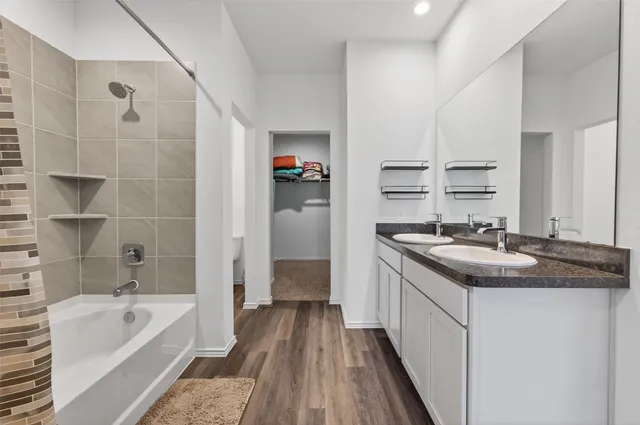 a kitchen with a sink stove and refrigerator