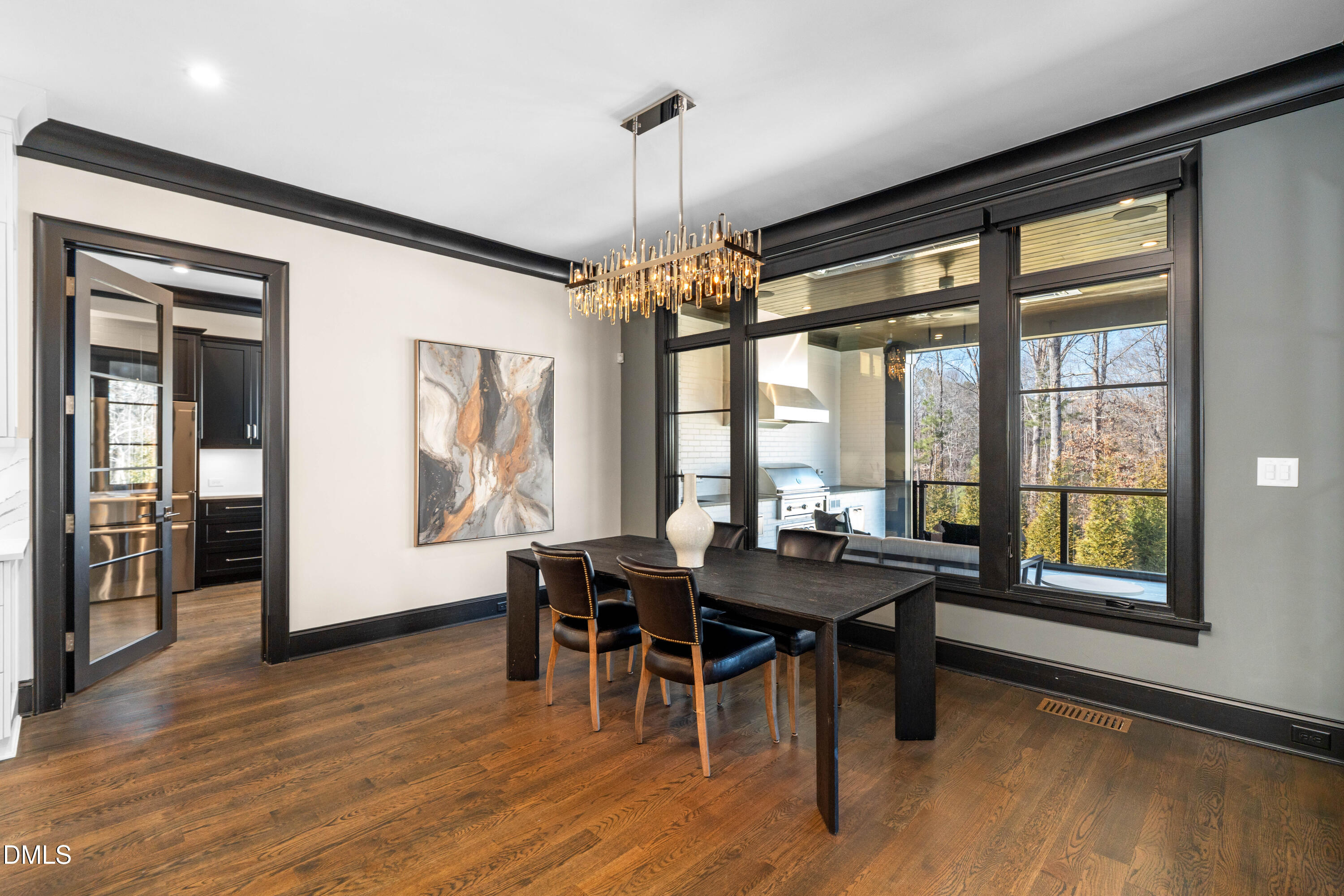 6508 Century Oak Court Raleigh, NC 27613 - Photo 14 of 91 a view of a dining room with furniture window and wooden floor