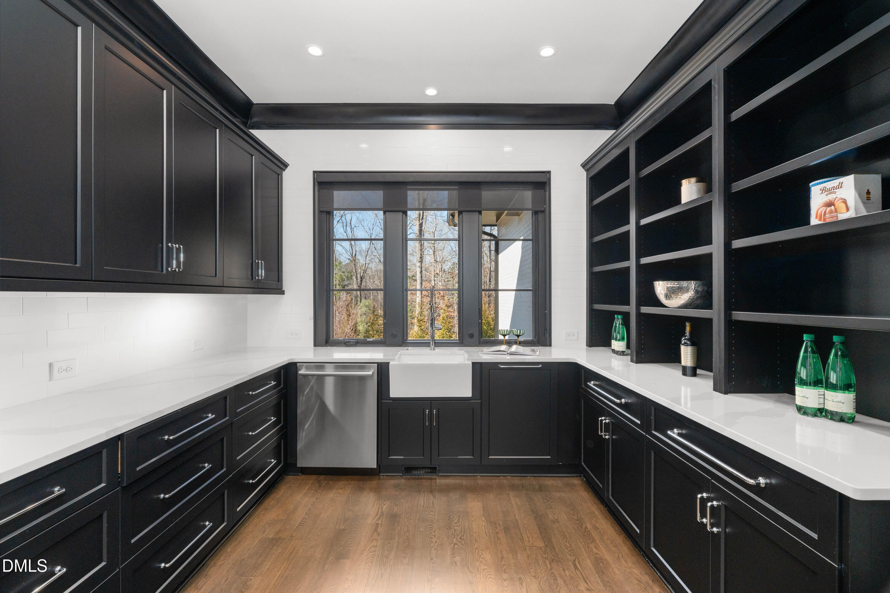6508 Century Oak Court Raleigh, NC 27613 - Photo 16 of 91 a kitchen with stainless steel appliances granite countertop a sink and a stove