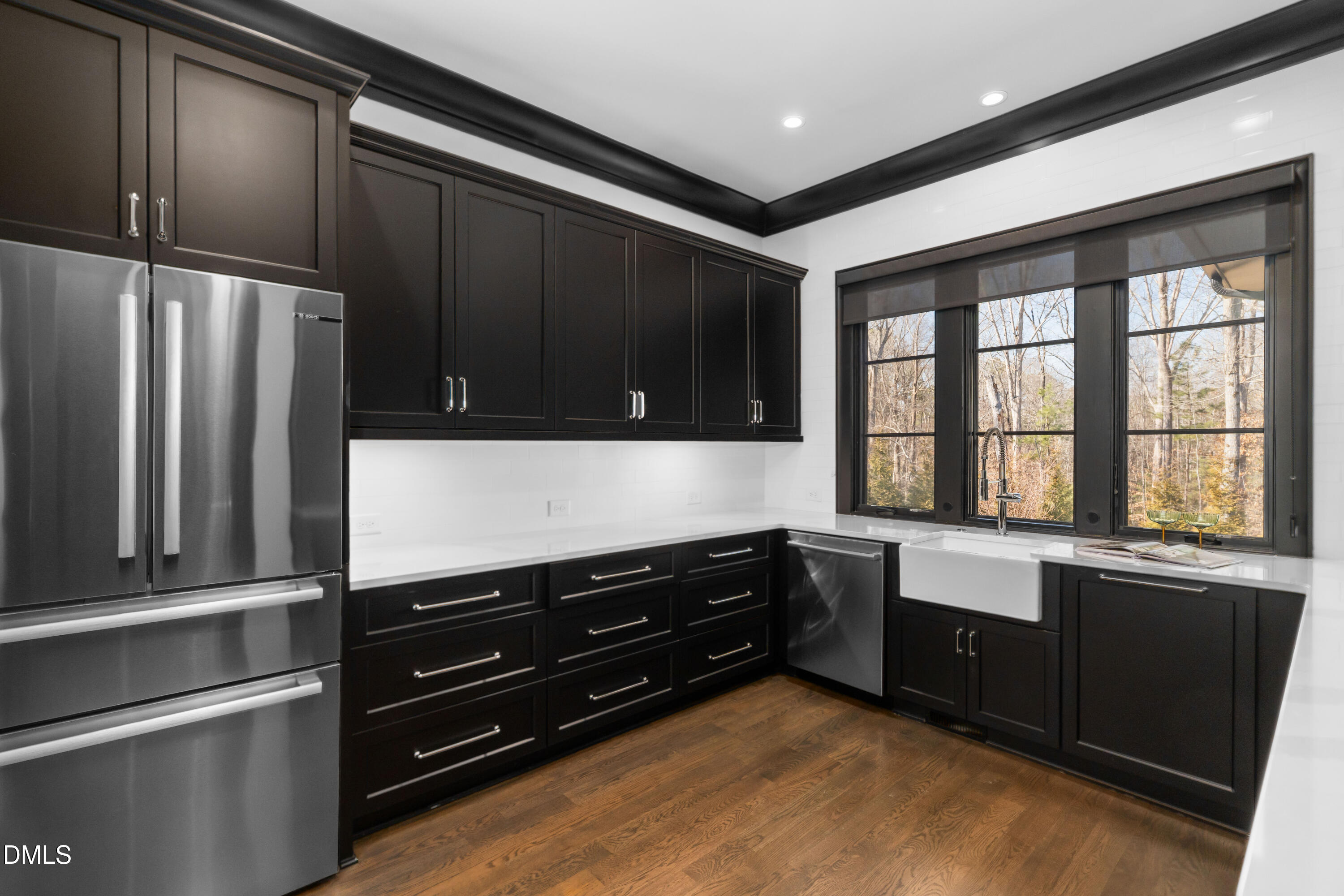 6508 Century Oak Court Raleigh, NC 27613 - Photo 17 of 91 a kitchen with granite countertop a refrigerator and cabinets