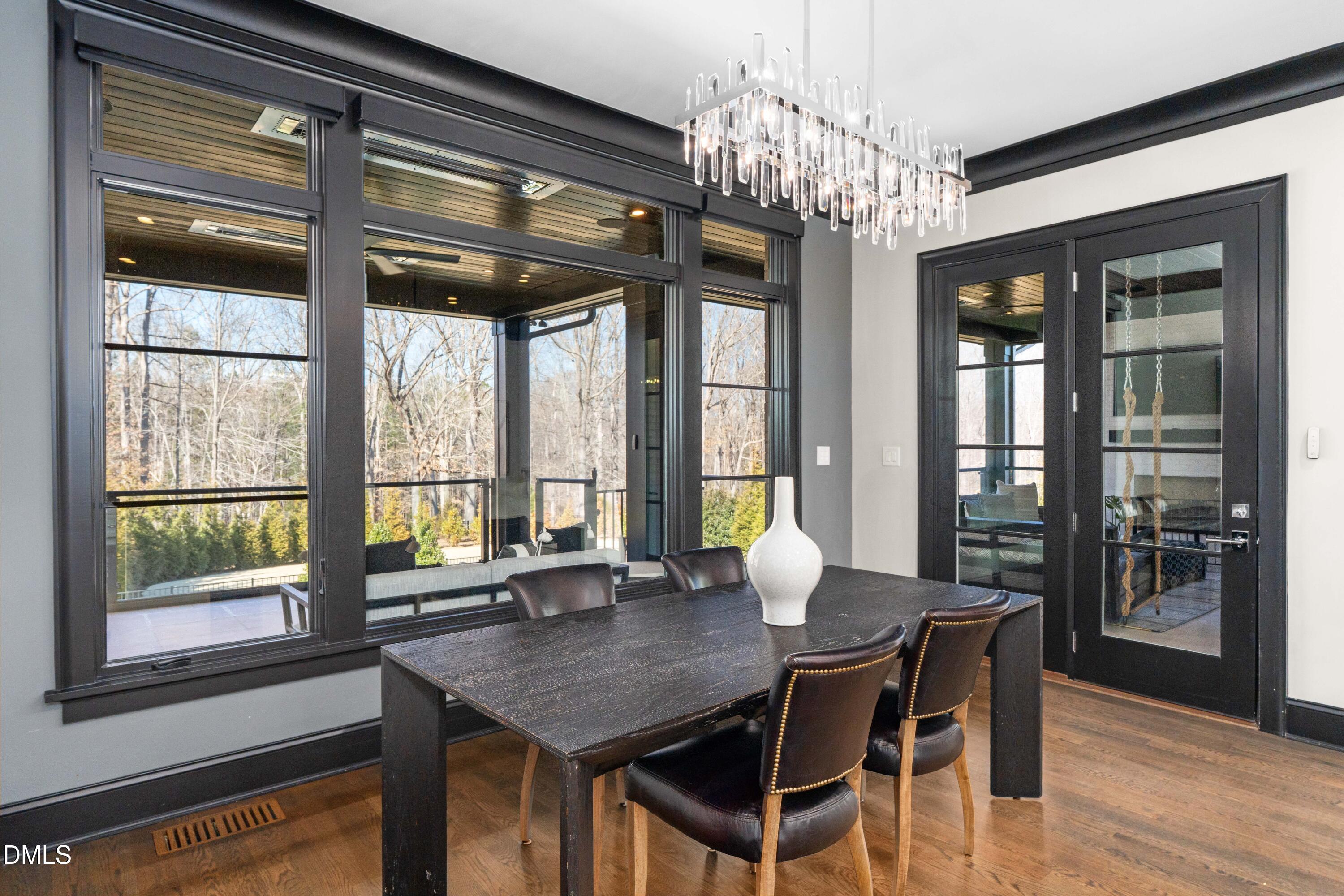 6508 Century Oak Court Raleigh, NC 27613 - Photo 19 of 91 a view of a dining room with furniture and window