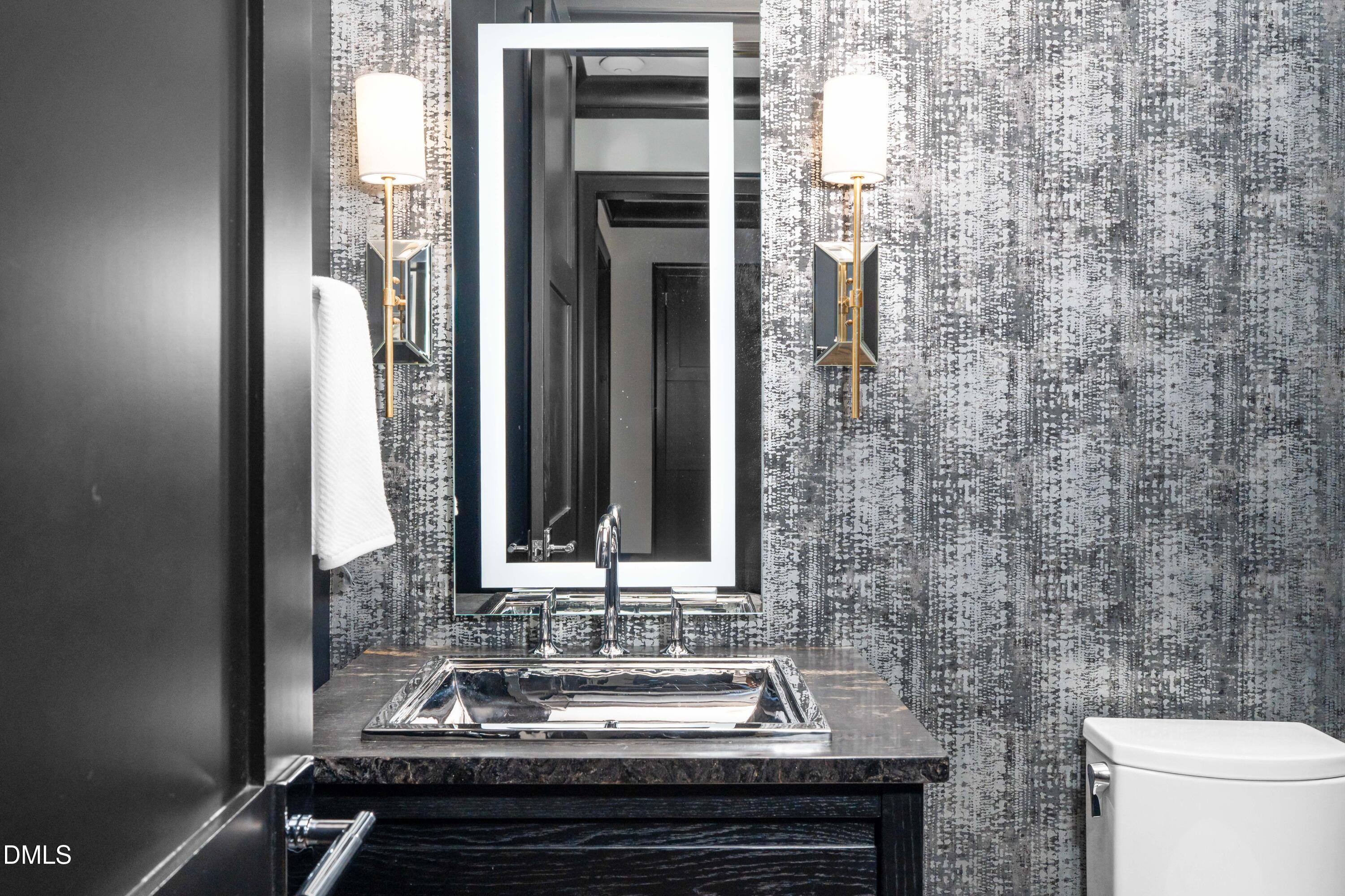 6508 Century Oak Court Raleigh, NC 27613 - Photo 34 of 91 a bathroom with a sink and a mirror
