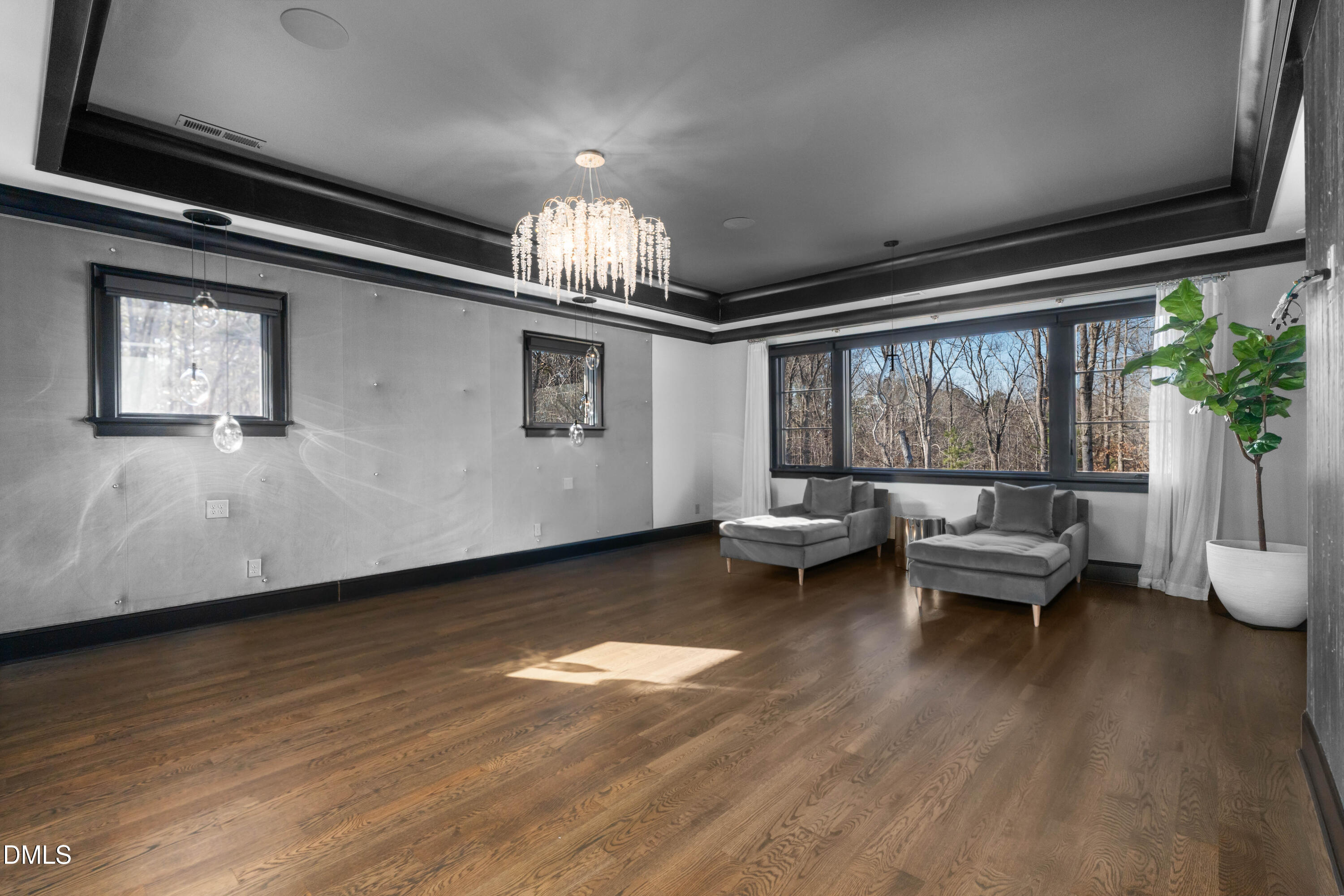 6508 Century Oak Court Raleigh, NC 27613 - Photo 36 of 91 a living room with furniture and a chandelier