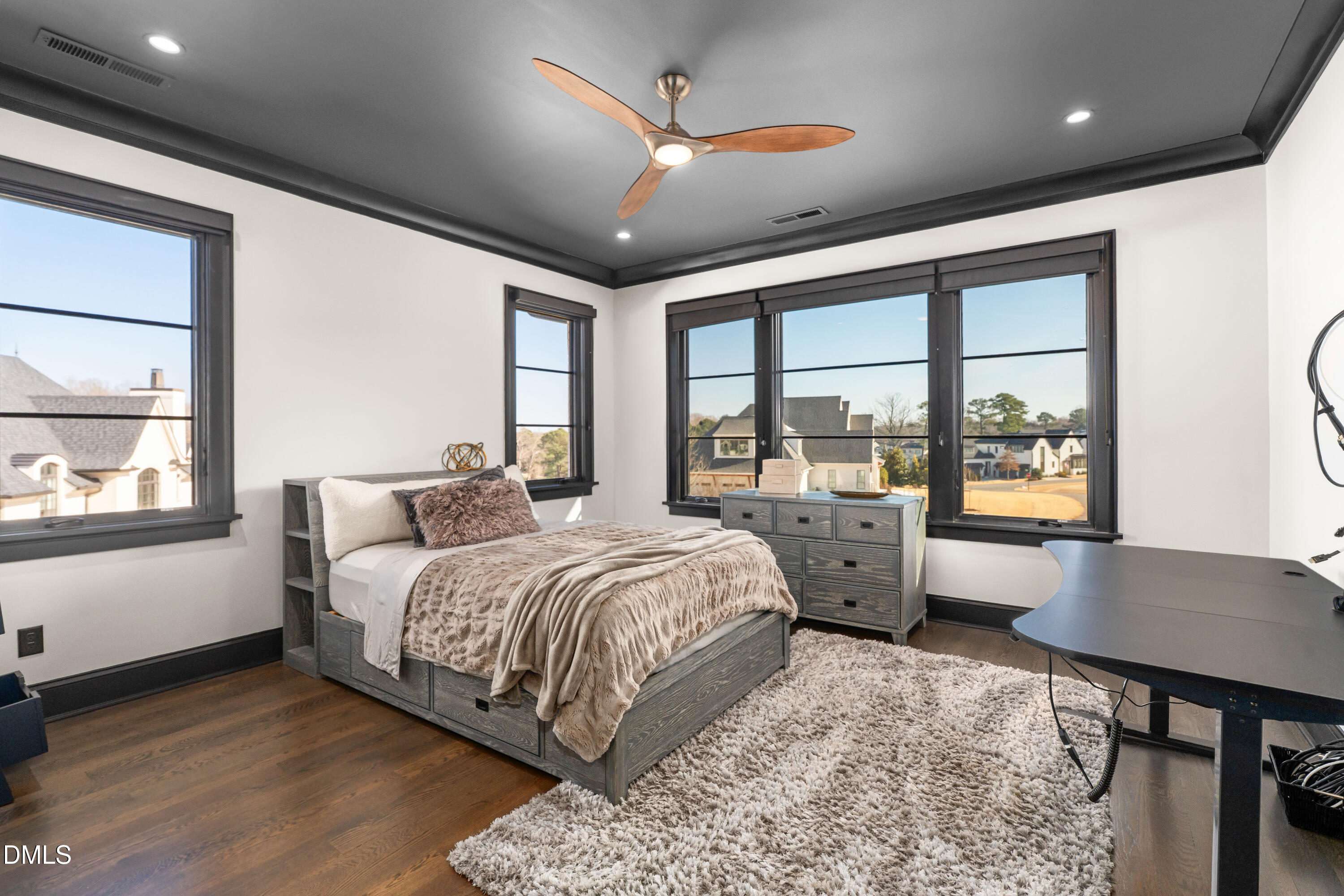 6508 Century Oak Court Raleigh, NC 27613 - Photo 54 of 91 a bed room with a bed and a large window