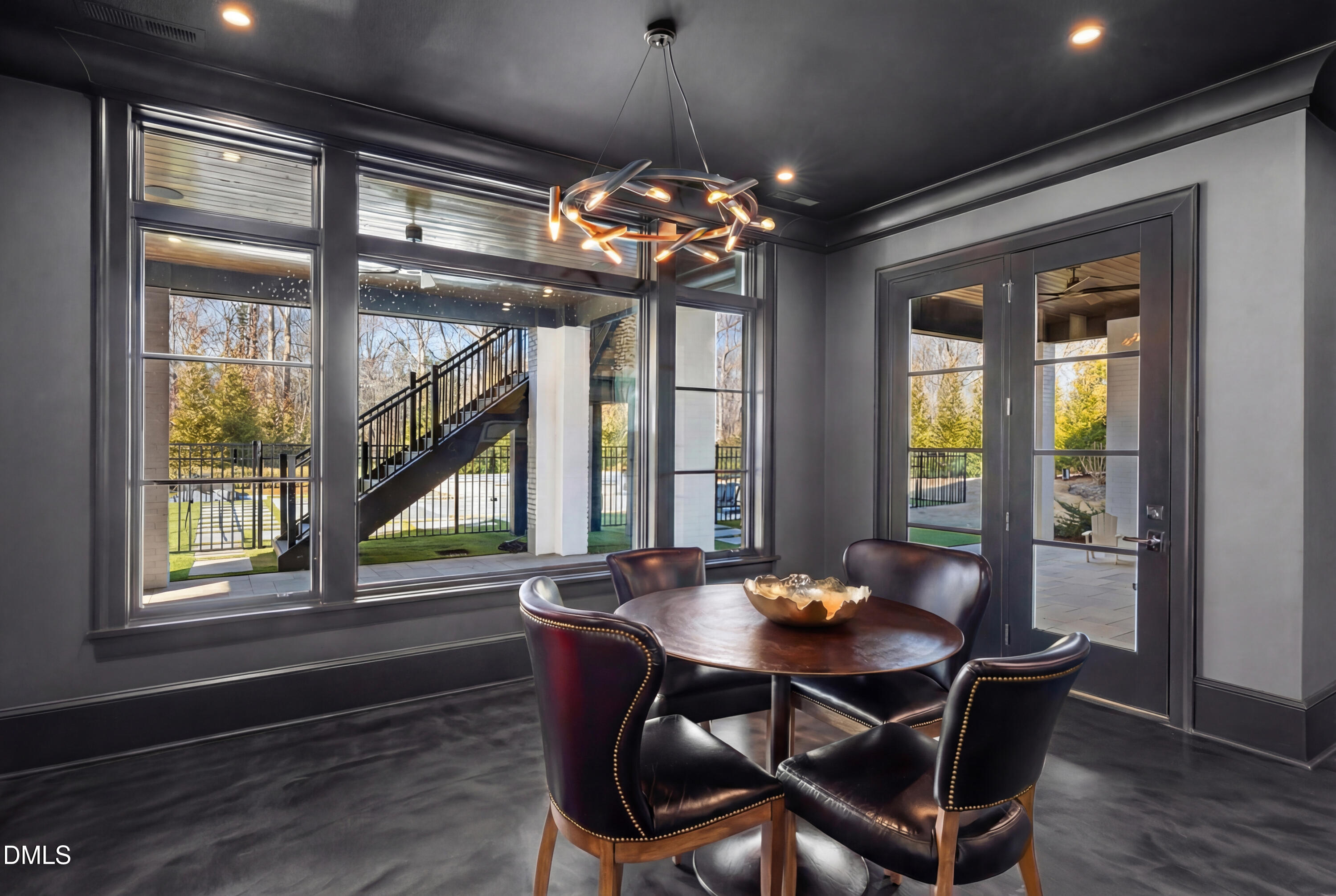 6508 Century Oak Court Raleigh, NC 27613 - Photo 59 of 91 a view of a dining room with furniture large windows and wooden floor