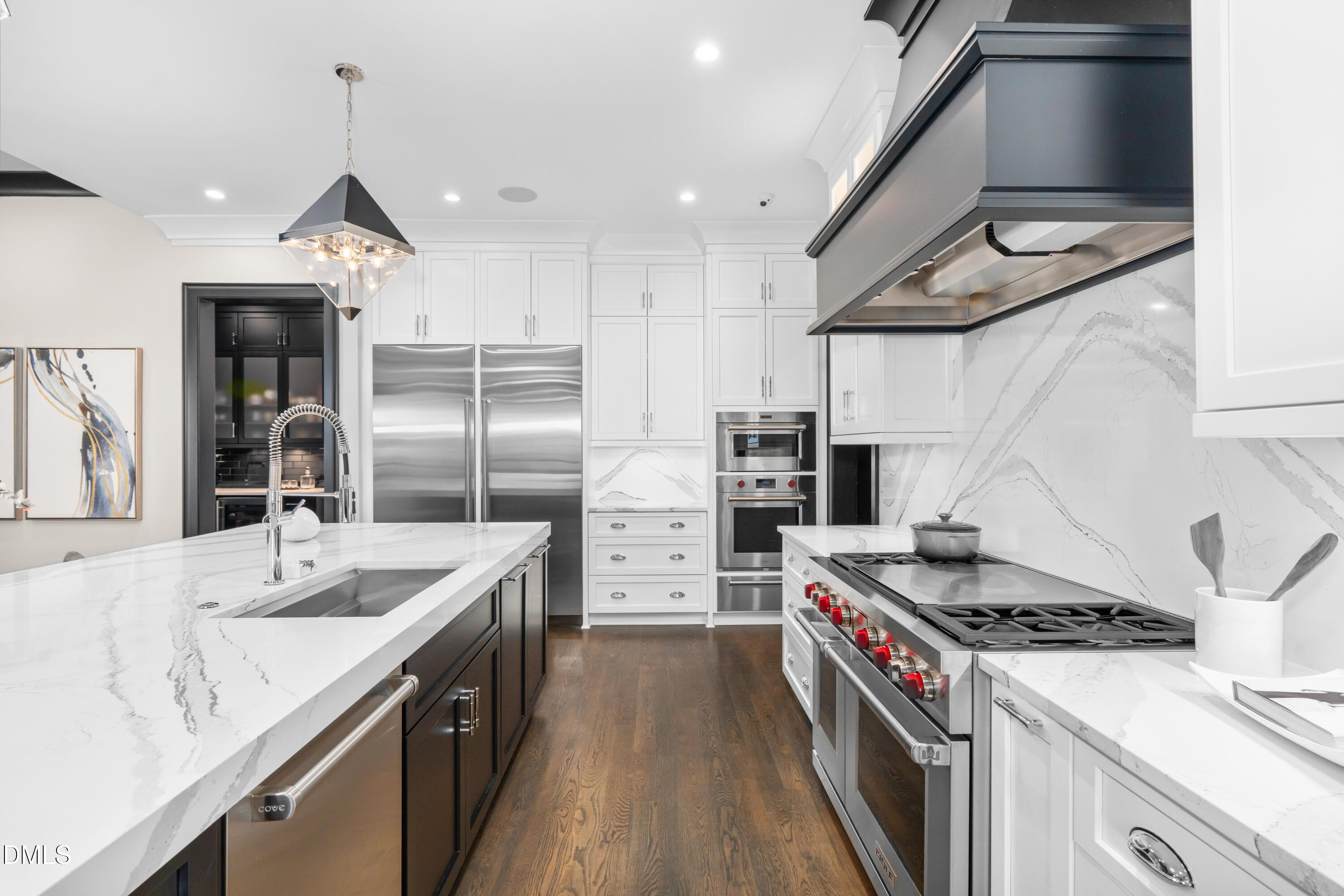 6508 Century Oak Court Raleigh, NC 27613 - Photo 6 of 91 a kitchen with stainless steel appliances granite countertop a stove and a refrigerator