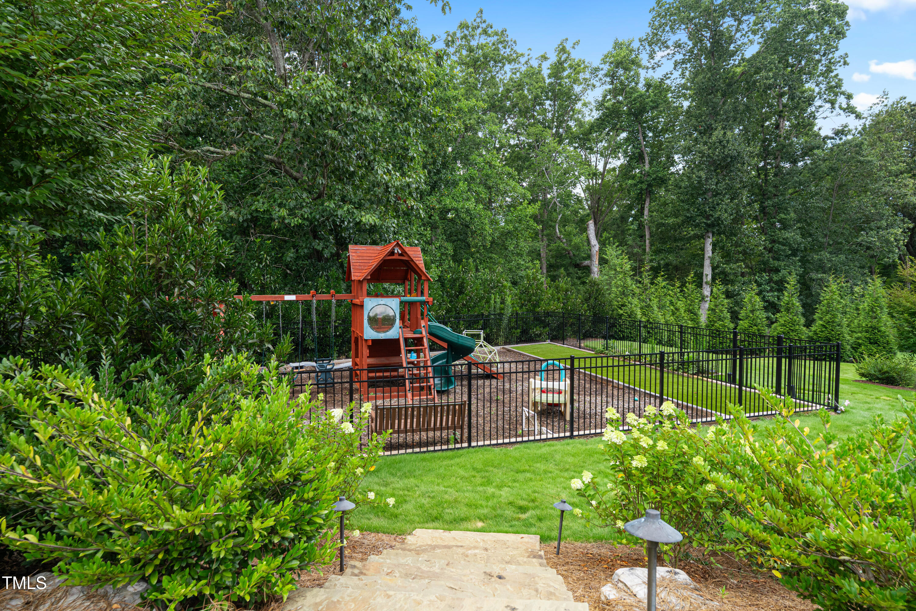 6508 Century Oak Court Raleigh, NC 27613 - Photo 68 of 91 a view of chair and table in the garden