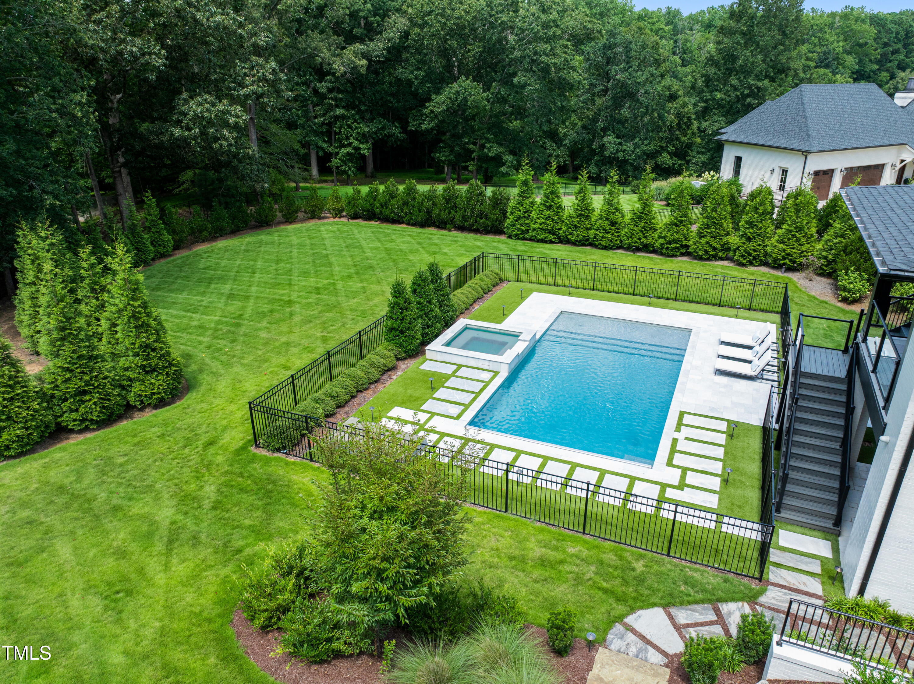6508 Century Oak Court Raleigh, NC 27613 - Photo 75 of 91 a view of a chairs and table in backyard of the house