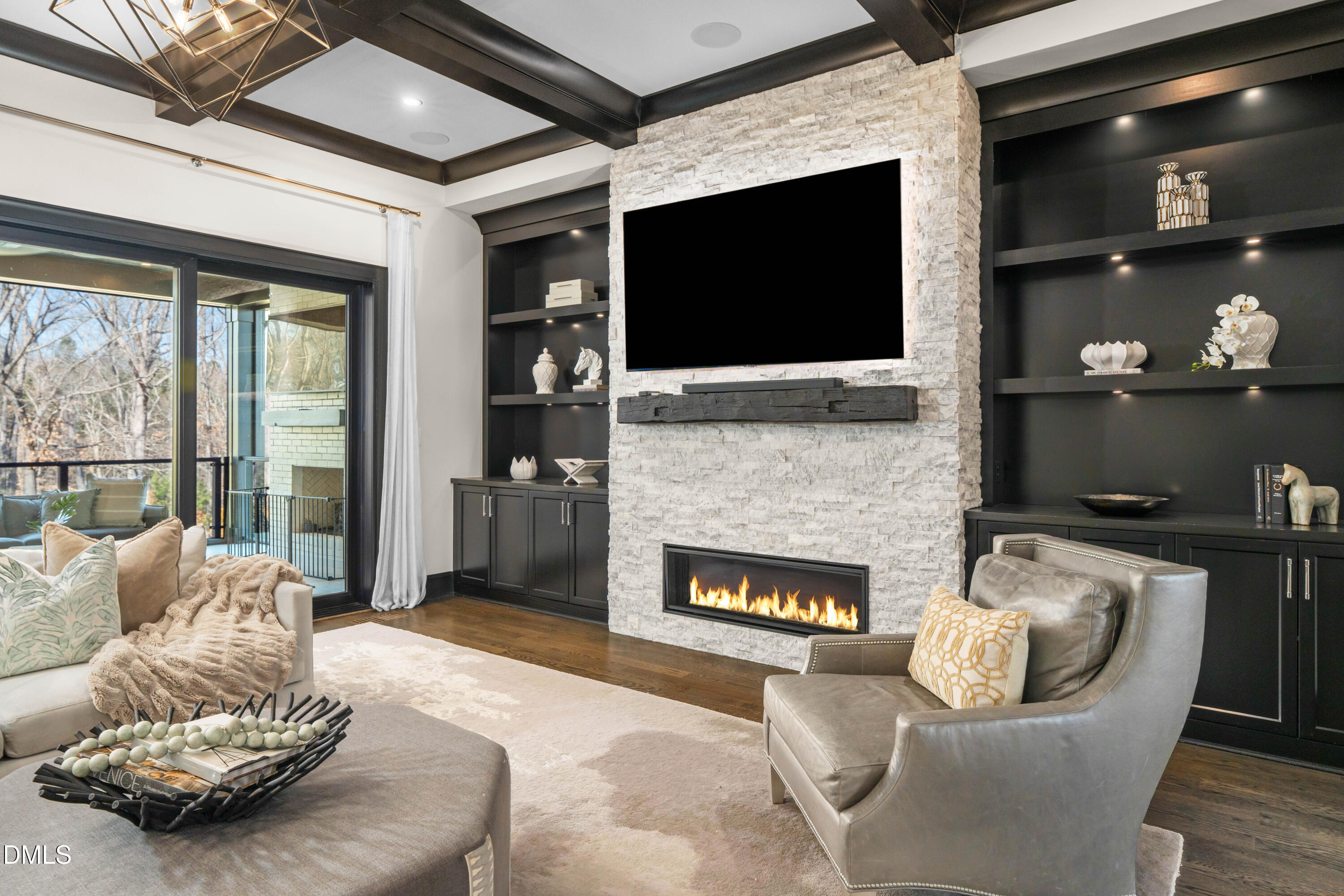 6508 Century Oak Court Raleigh, NC 27613 - Photo 8 of 91 a living room with furniture a flat screen tv and a fireplace