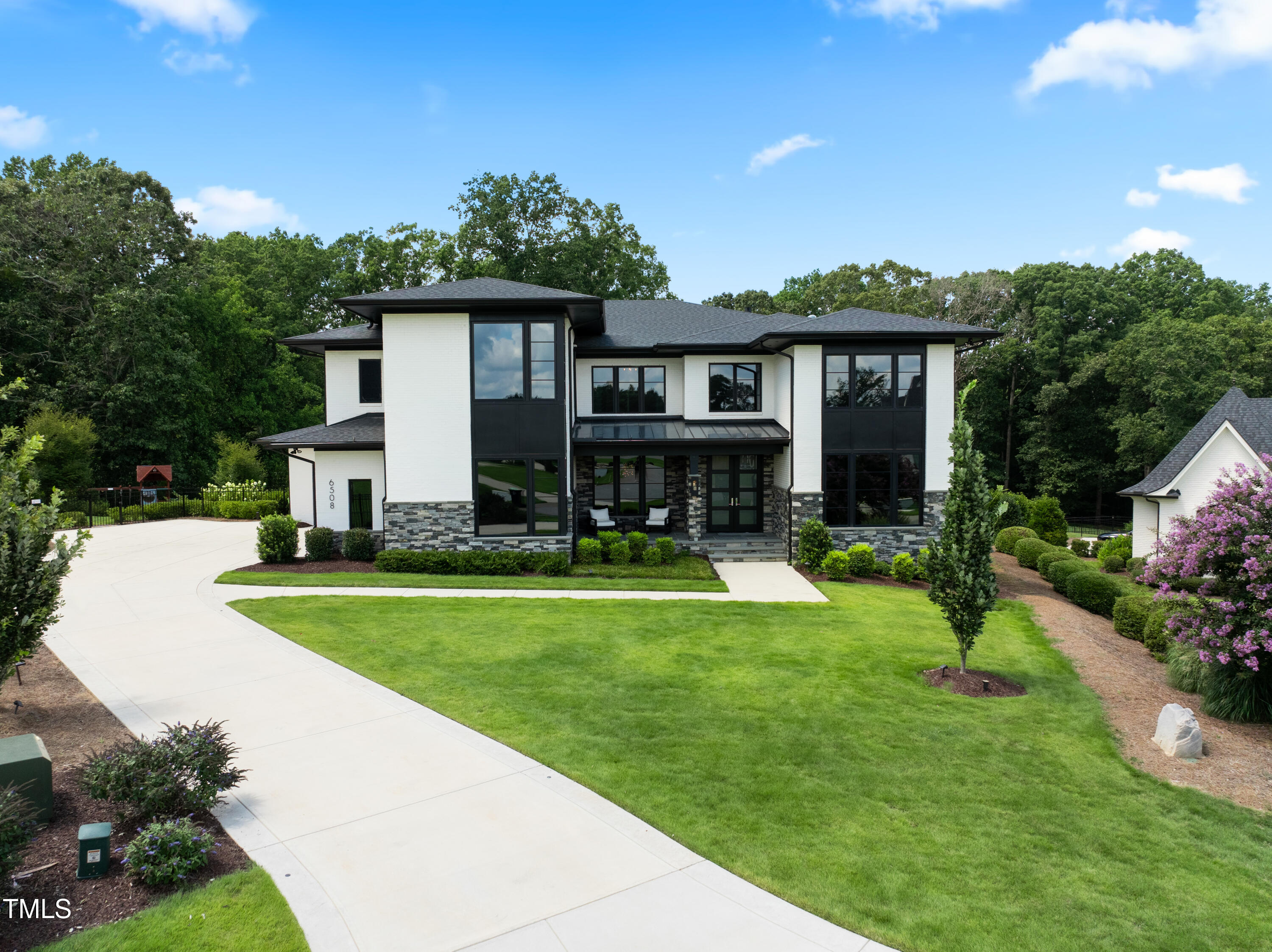 6508 Century Oak Court Raleigh, NC 27613 - Photo 88 of 91 a front view of house with yard and outdoor seating