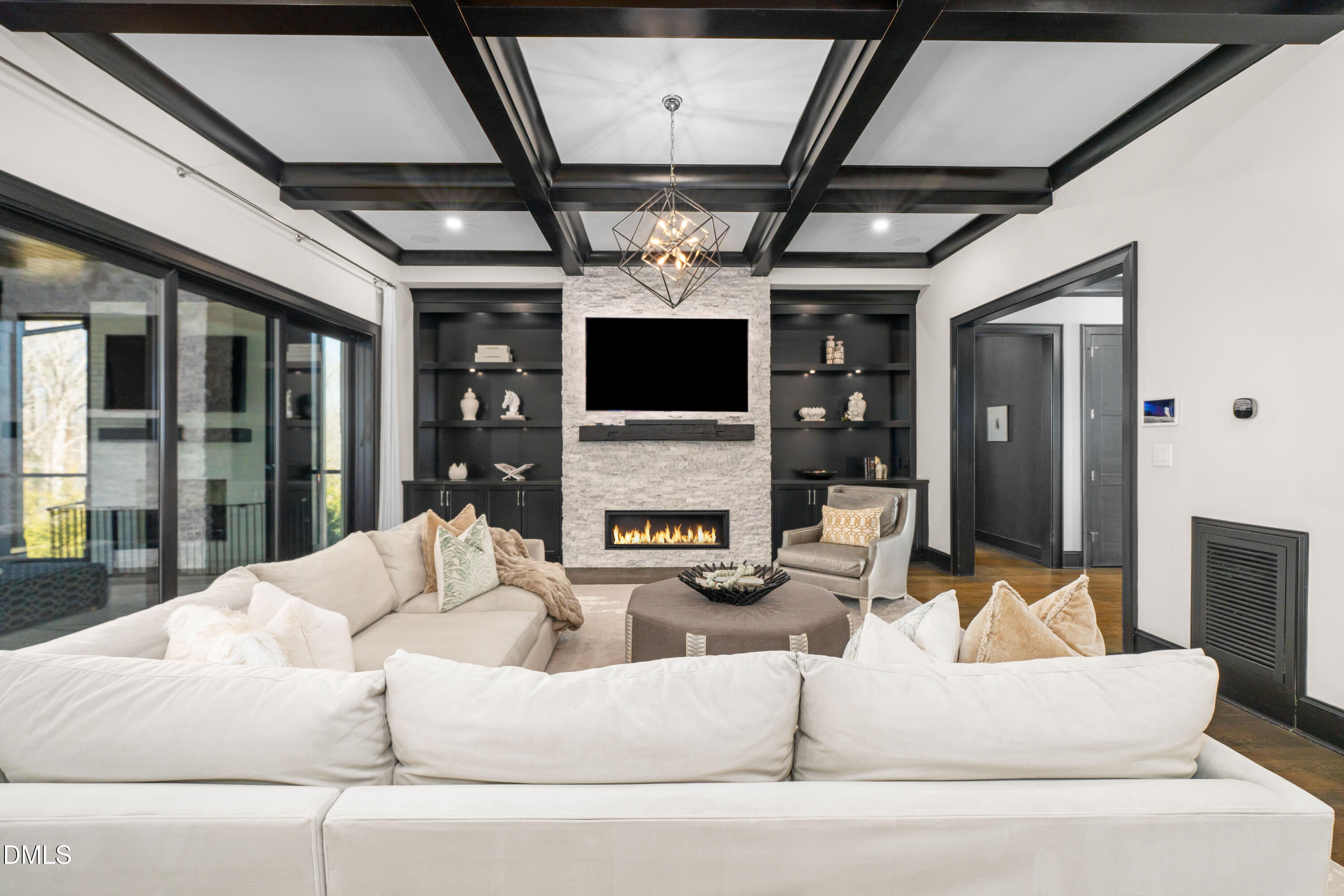 6508 Century Oak Court Raleigh, NC 27613 - Photo 10 of 91 a living room with furniture a fireplace and a flat screen tv