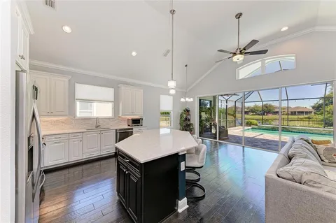 a large kitchen with a table and chairs