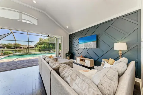 a room with furniture and a flat screen tv