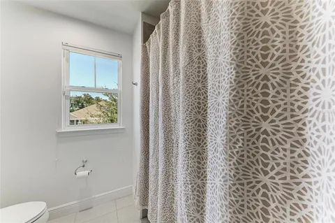 a view of a backyard with potted plants