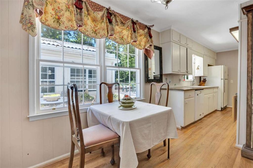 103 Gabriel Way Social Circle, GA 30025 - Photo 22 of 70 a view of a dining room with furniture a livingroom and chandelier