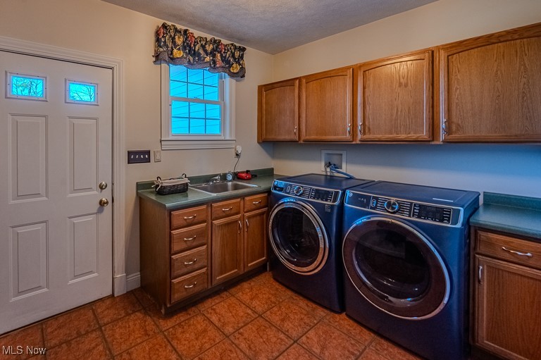 434 Rector Road Parkersburg, WV 26104 - Photo 35 of 50 Laundry room featuring a textured ceiling, washing machine and dryer, cabinet space, and a sink