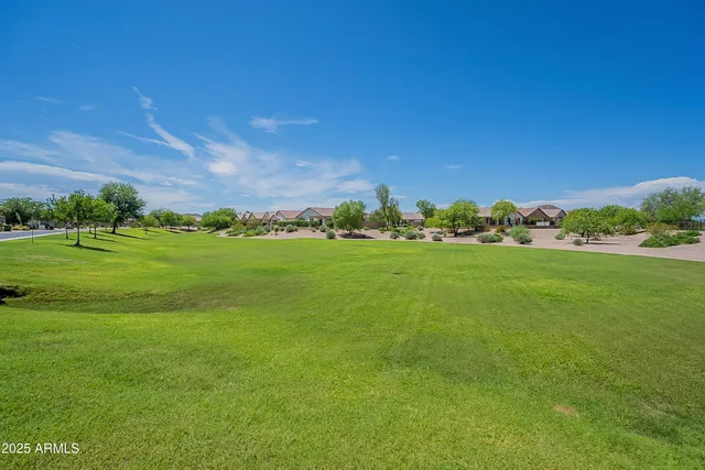 an aerial view of a city with lawn chairs