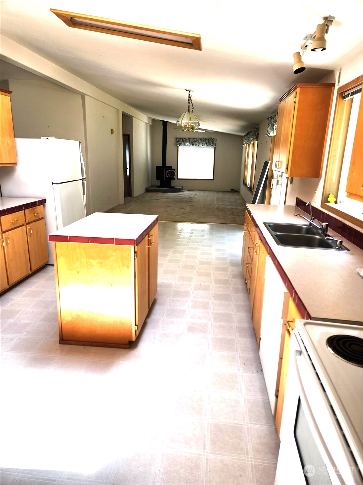 705 Eufaula Heights Road Longview, WA 98632 - Photo 5 of 17 a view of a kitchen with stainless steel appliances granite countertop a sink and a stove