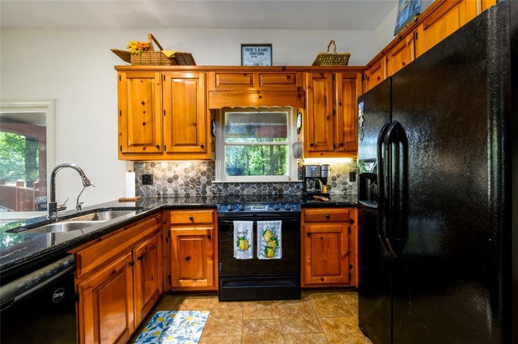 4955-h D H D Atha Road Covington, GA 30014 - Photo 16 of 76 a kitchen with stainless steel appliances granite countertop a refrigerator and a stove