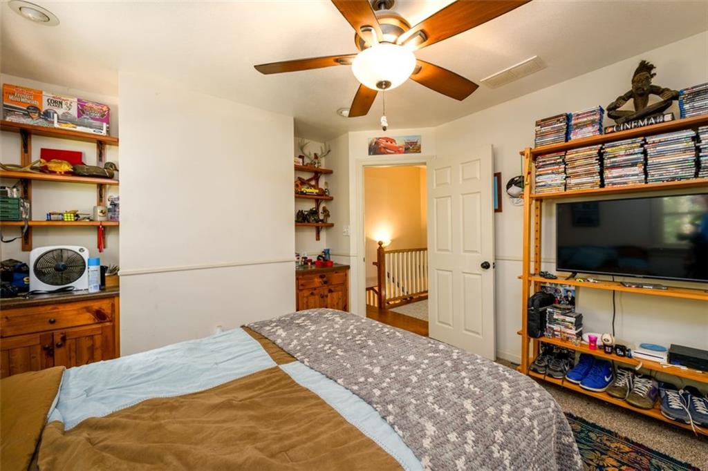 4955-h D H D Atha Road Covington, GA 30014 - Photo 35 of 76 a bedroom with a bed and a flat screen tv