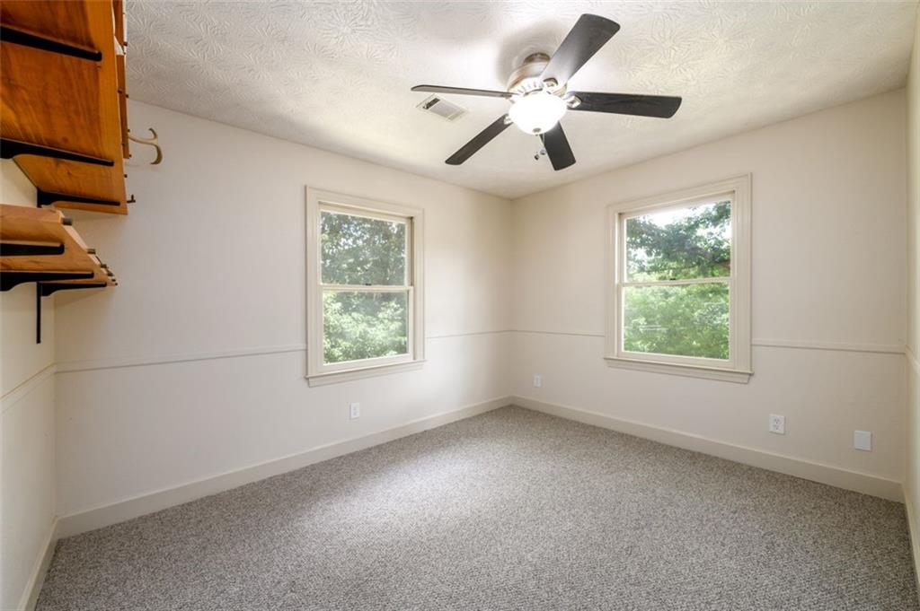 4955-h D H D Atha Road Covington, GA 30014 - Photo 36 of 76 a view of an empty room with a window