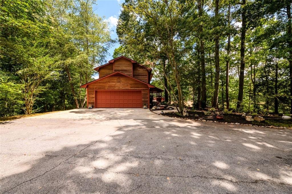 4955-h D H D Atha Road Covington, GA 30014 - Photo 7 of 76 a front view of a house with a yard