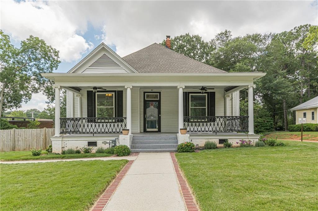 1808 Cambridge Avenue Atlanta, GA 30337 - Photo 1 of 1 a front view of a house with a yard