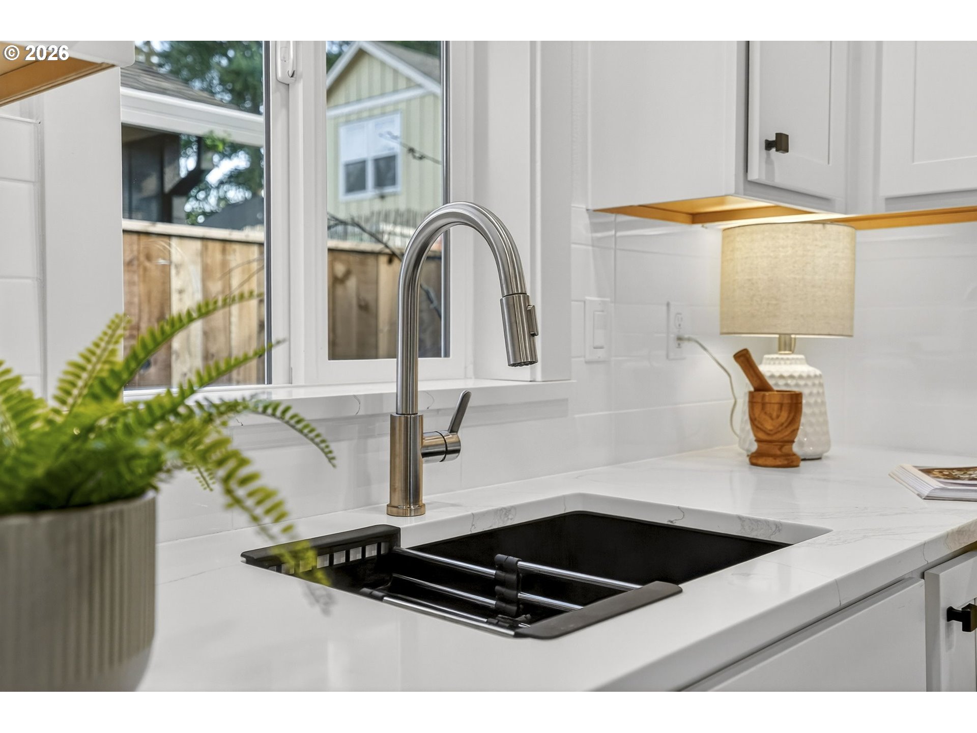 7602 Southeast Carlton Street, Unit B Portland, OR 97206 - Photo 11 of 34 a kitchen with a sink and a stove