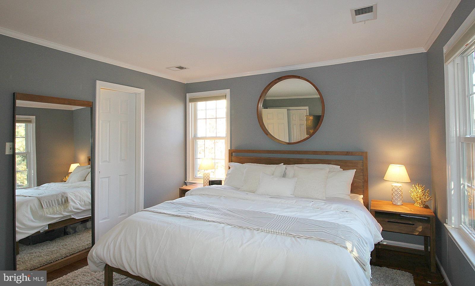424 West Glebe Road Alexandria, VA 22305 - Photo 11 of 24 a bedroom with a bed and a mirror