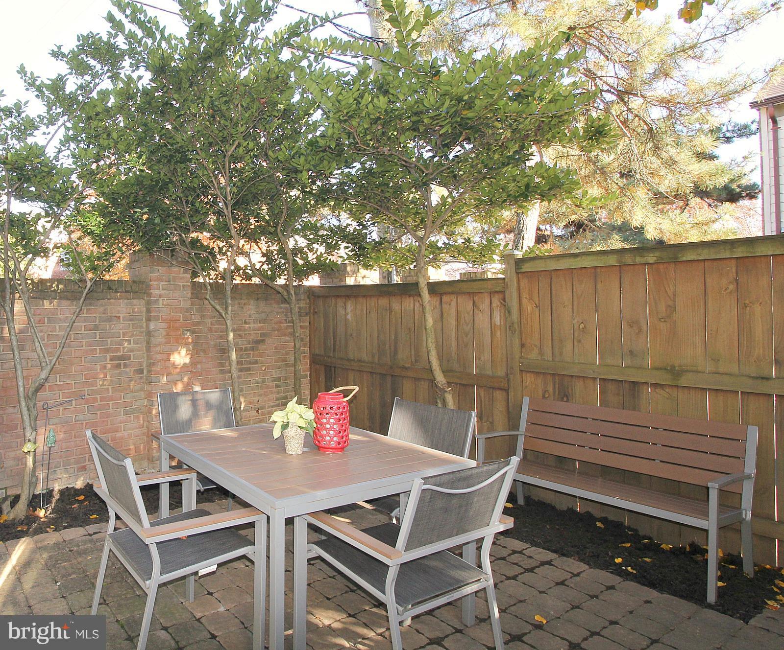 424 West Glebe Road Alexandria, VA 22305 - Photo 22 of 24 a outdoor dining space with furniture and a potted plant