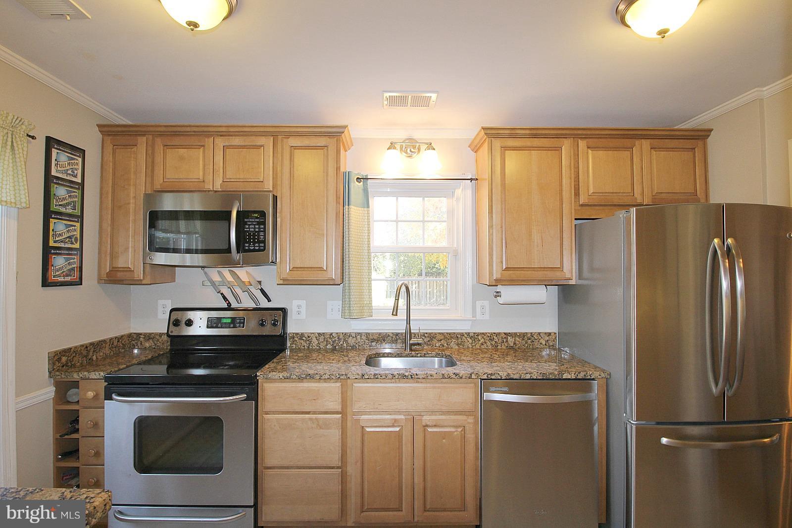 424 West Glebe Road Alexandria, VA 22305 - Photo 7 of 24 a kitchen with a stove a sink and a refrigerator